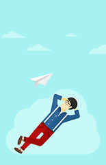 Image showing Businessman relaxing on cloud.