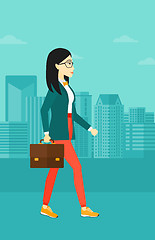 Image showing Business woman walking with briefcase. 