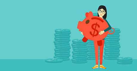 Image showing Woman carrying piggy bank.