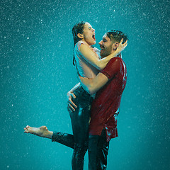 Image showing The loving couple in the rain