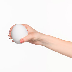 Image showing The female hand holding white blank styrofoam oval 