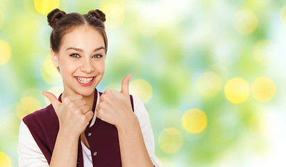 Image showing happy teenage girl showing thumbs up