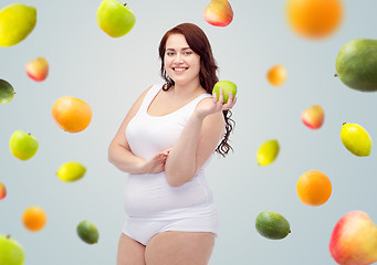 Image showing happy plus size woman in underwear with apple