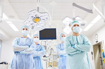 Image showing group of surgeons in operating room at hospital