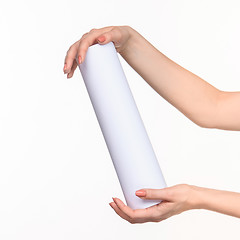 Image showing The cylinder female hands on white background