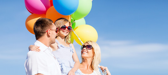 Image showing family with colorful balloons