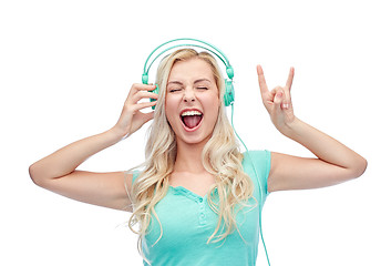 Image showing happy young woman or teenage girl with headphones