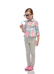 Image showing little girl in eyeglasses with magnifying glass