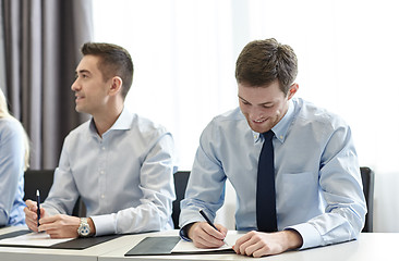 Image showing group of smiling businesspeople meeting in office