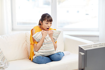 Image showing asian young woman watching tv at home