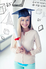 Image showing student in graduation cap with certificate