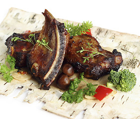 Image showing Pork ribs with mushrooms and herbs