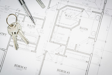Image showing Engineer Pencil, Ruler and Keys Resting On House Plans