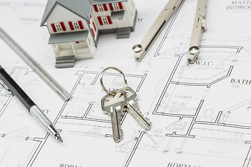 Image showing Home, Pencil, Ruler, Compass and Key Resting on House Plans