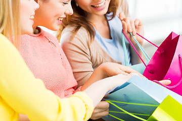 Image showing close up of happy teenage girls with shopping bags