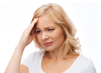 Image showing unhappy woman suffering from headache