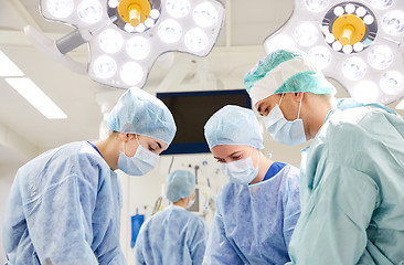 Image showing group of surgeons in operating room at hospital