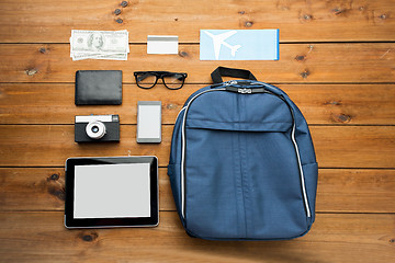 Image showing close up of smartphone and travel stuff