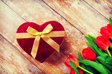 Image showing close up of red tulips and chocolate box