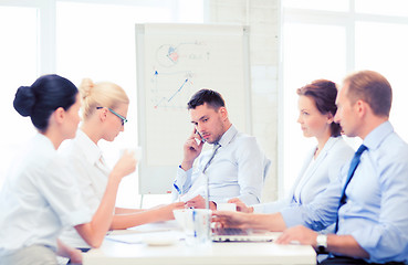 Image showing stressed male boss on business meeting