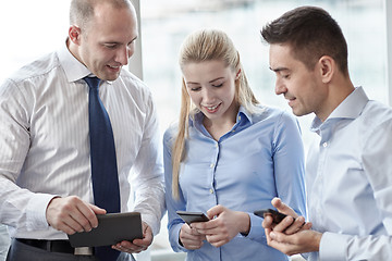 Image showing business people with tablet pc and smartphones