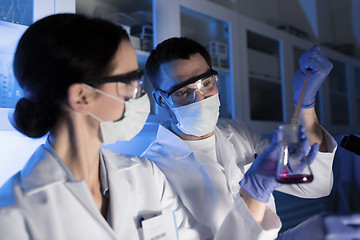 Image showing close up of scientists making test in lab