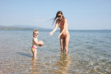 Image showing Mother and daughter in same bikinis