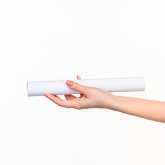 Image showing The cylinder female hands on white background