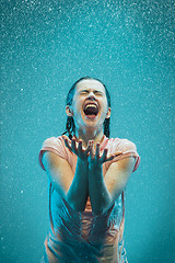 Image showing The portrait of young beautiful woman in the rain