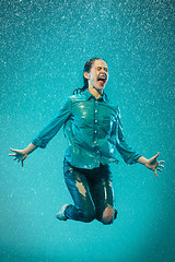 Image showing The portrait of young beautiful woman in the rain