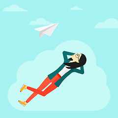 Image showing Business woman relaxing on cloud.