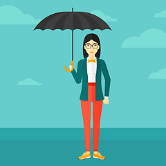 Image showing Business woman standing with umbrella.