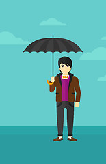 Image showing Businessman standing with umbrella.