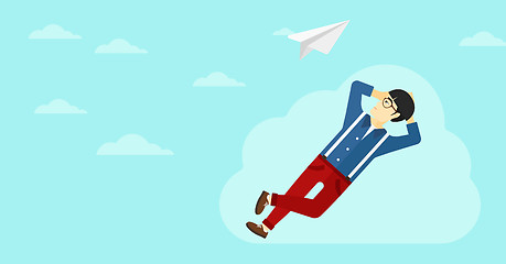 Image showing Businessman relaxing on cloud.