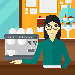 Image showing Barista standing near coffee maker.