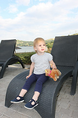 Image showing Little girl in easy chair