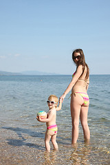 Image showing Mother and daughter in same bikinis