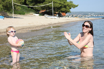 Image showing Mother and daughter in same bikinis