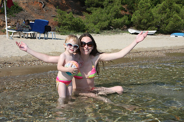 Image showing Mother and daughter in same bikinis