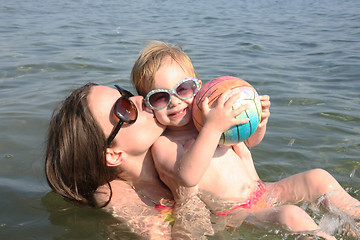 Image showing Mother and daughter playing in the sea