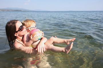 Image showing Mother and daughter playing in the sea