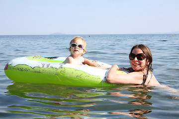 Image showing Mother and daughter floating in the sea