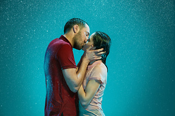 Image showing The loving couple in the rain