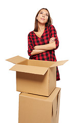 Image showing Young woman with cardboard boxes