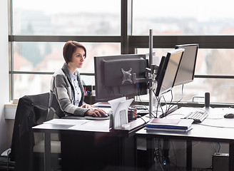 Image showing Business woman working in corporate office.