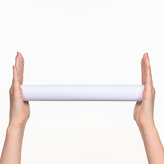 Image showing The cylinder female hands on white background