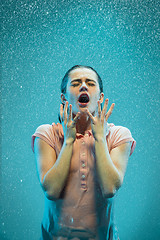 Image showing The portrait of young beautiful woman in the rain