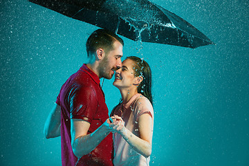 Image showing The loving couple in the rain