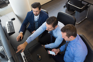 Image showing Business team analyzing data on computer.