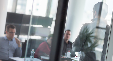 Image showing Business team leader delivering presentation in office.